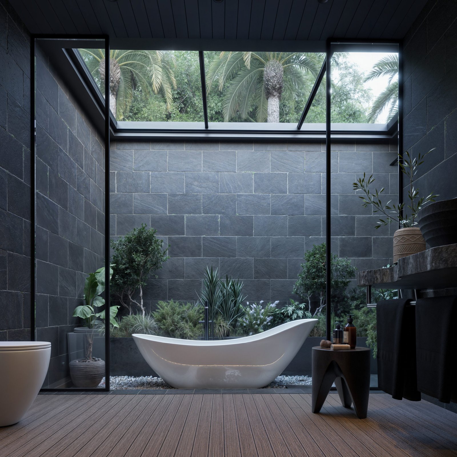 Modern open-air bathroom with dark stone walls and skylight
