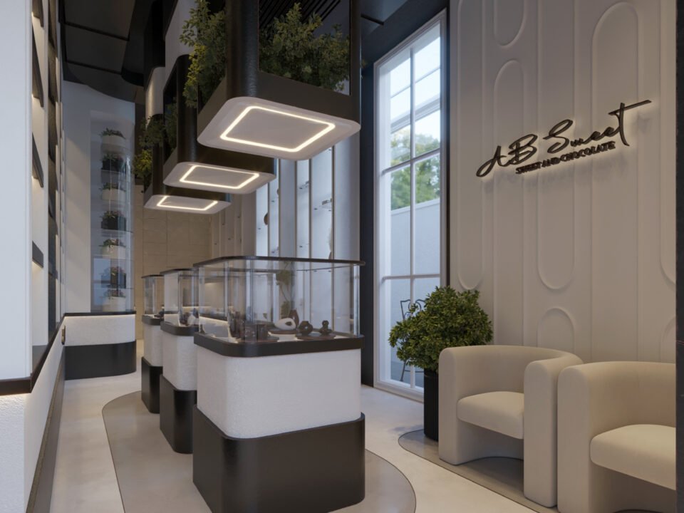 Modern chocolate boutique interior with black and white design and illuminated display units