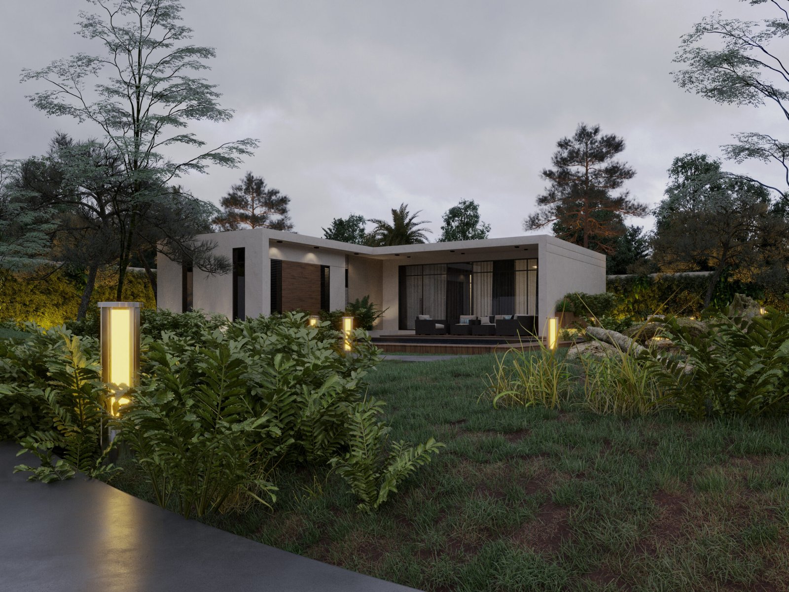 Wide view showing the house integrated into a lush forest landscape with pathway lighting
