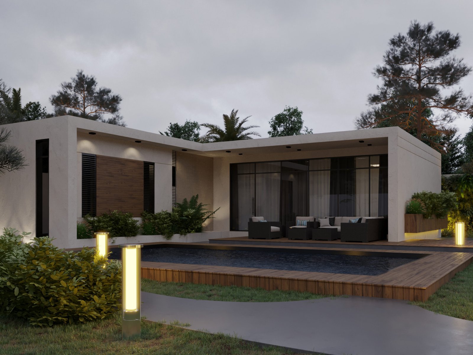 Wide view showing the house integrated into a lush forest landscape with pathway lighting