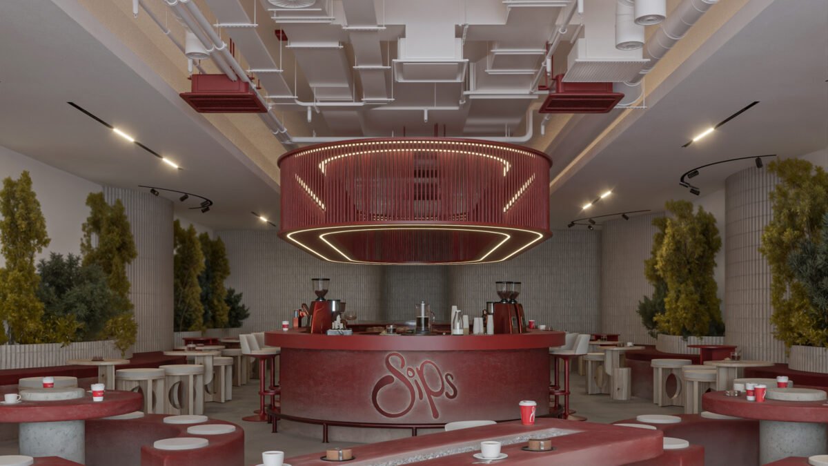 Modern café interior with red curved seating and central bar in Basrah