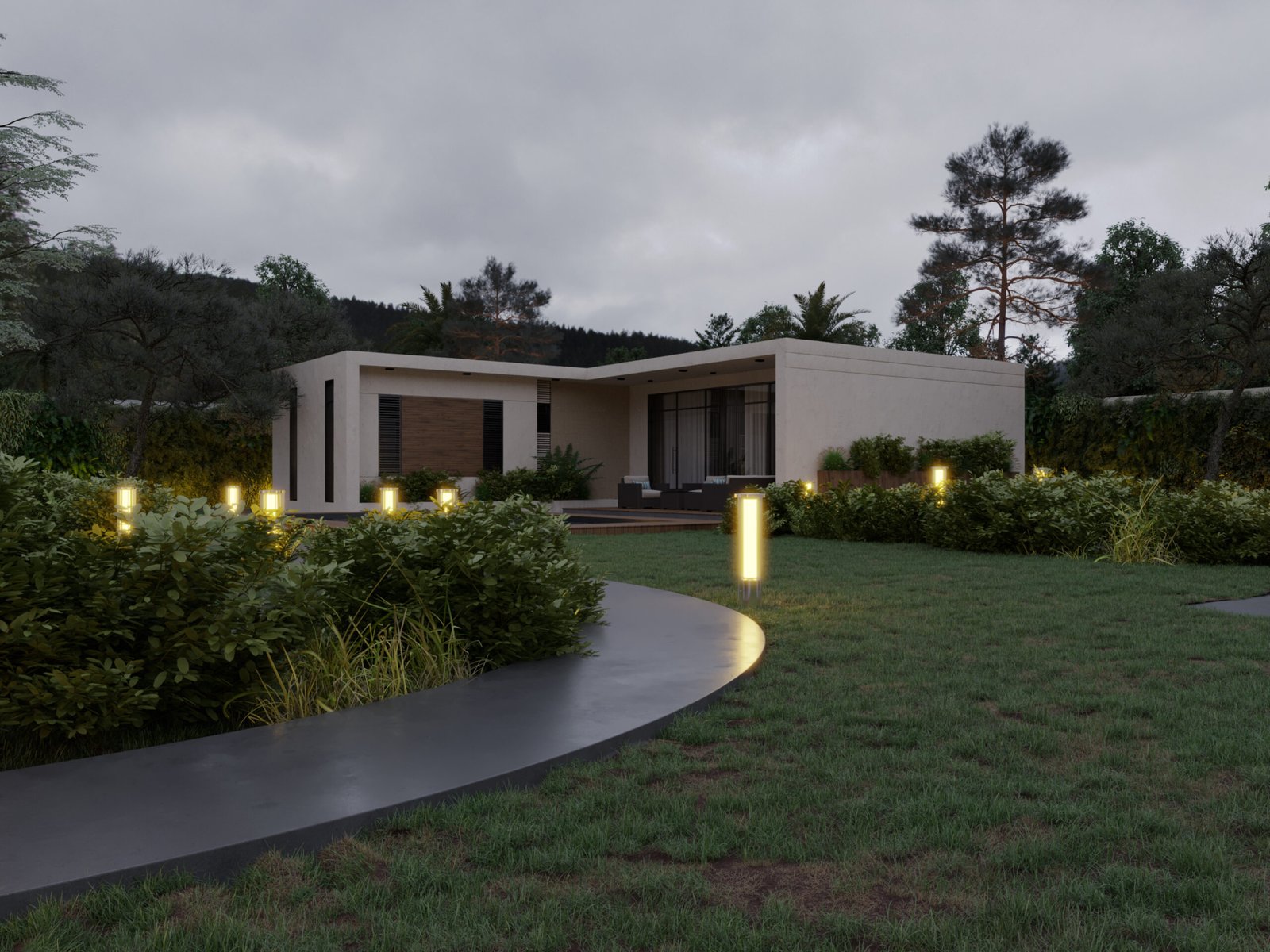 Wide view showing the house integrated into a lush forest landscape with pathway lighting
