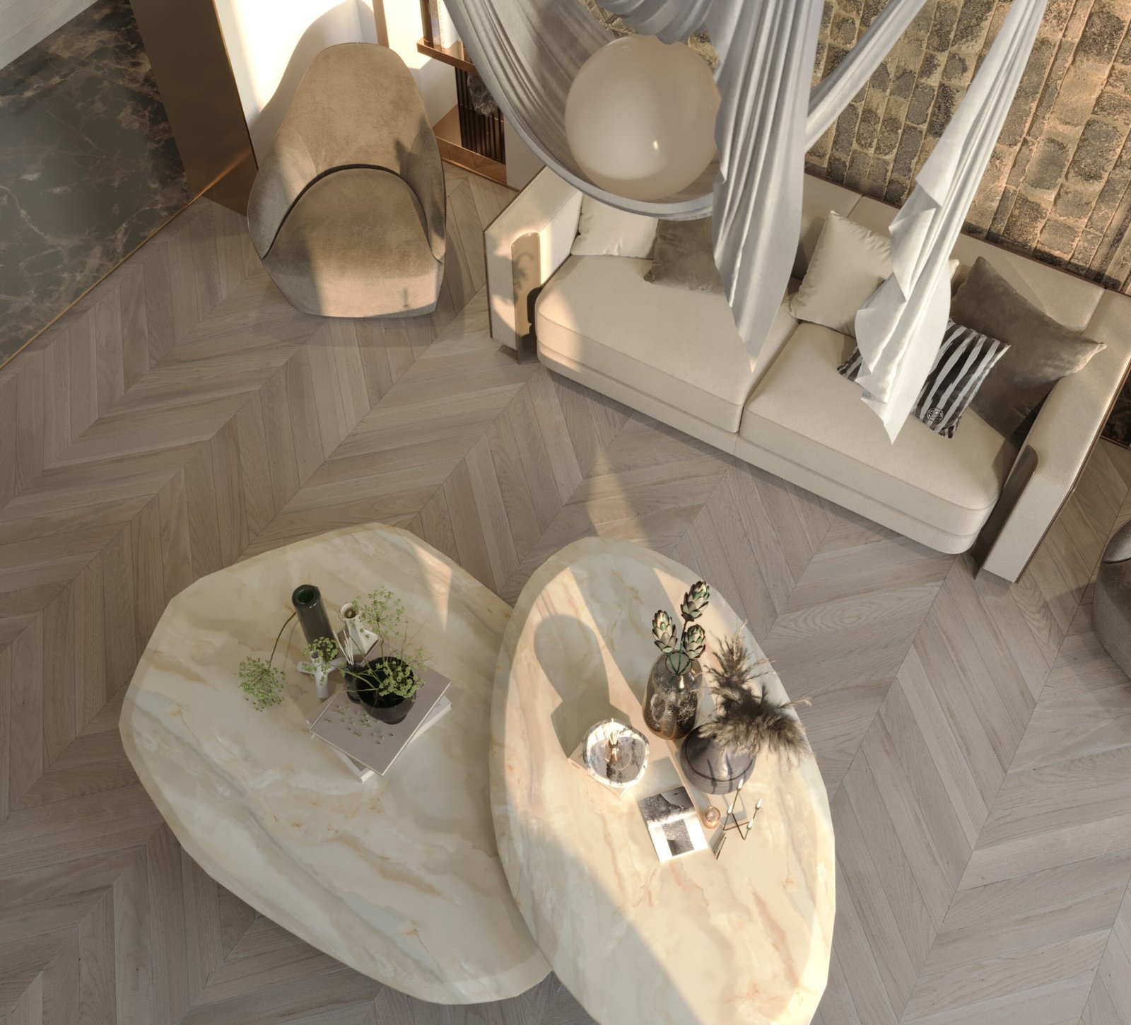 A contemporary seating arrangement featuring neutral-toned sofas, sculptural tables, and natural materials.