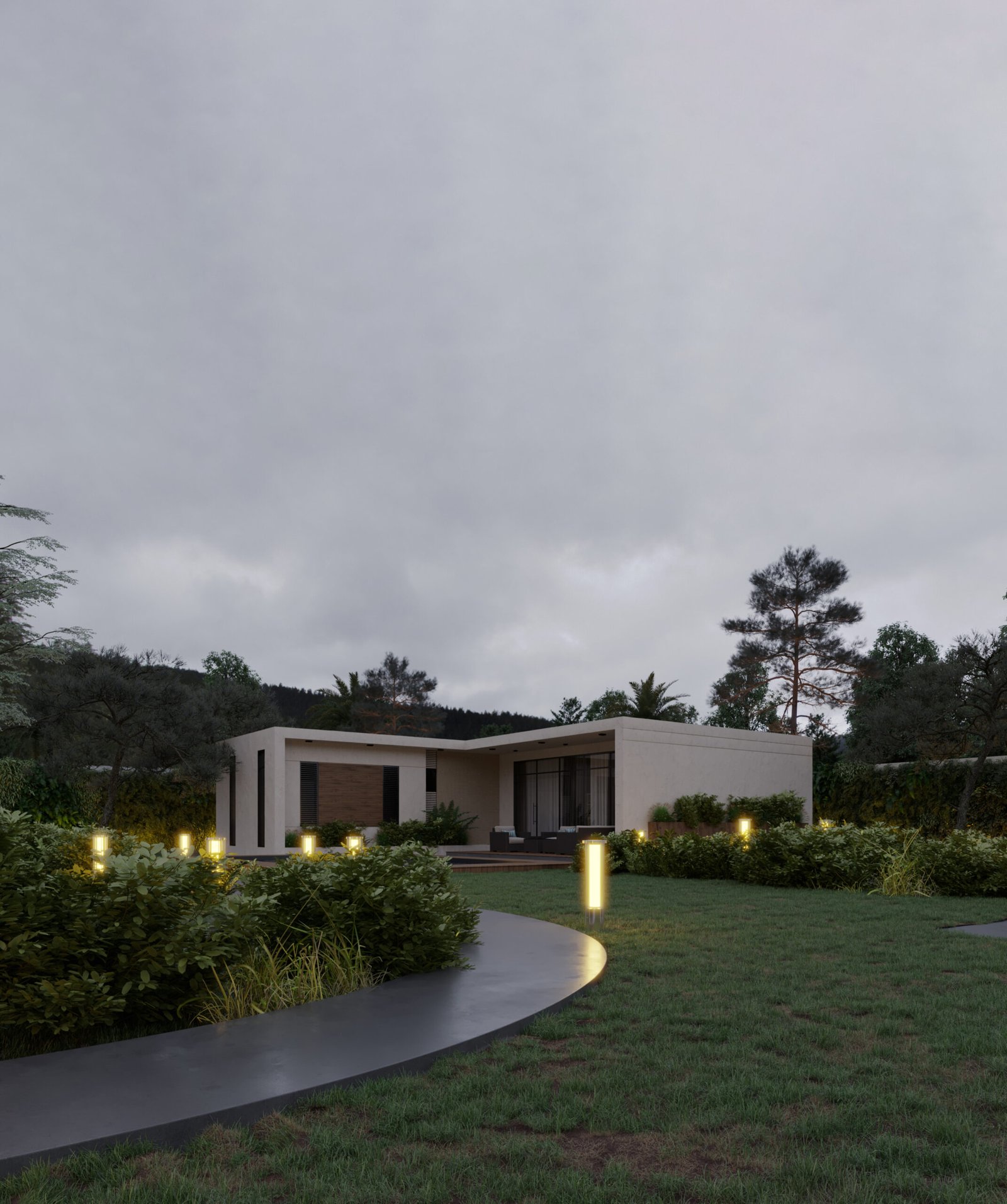 Outdoor seating area overlooking a pool with warm lighting and minimalist architecture