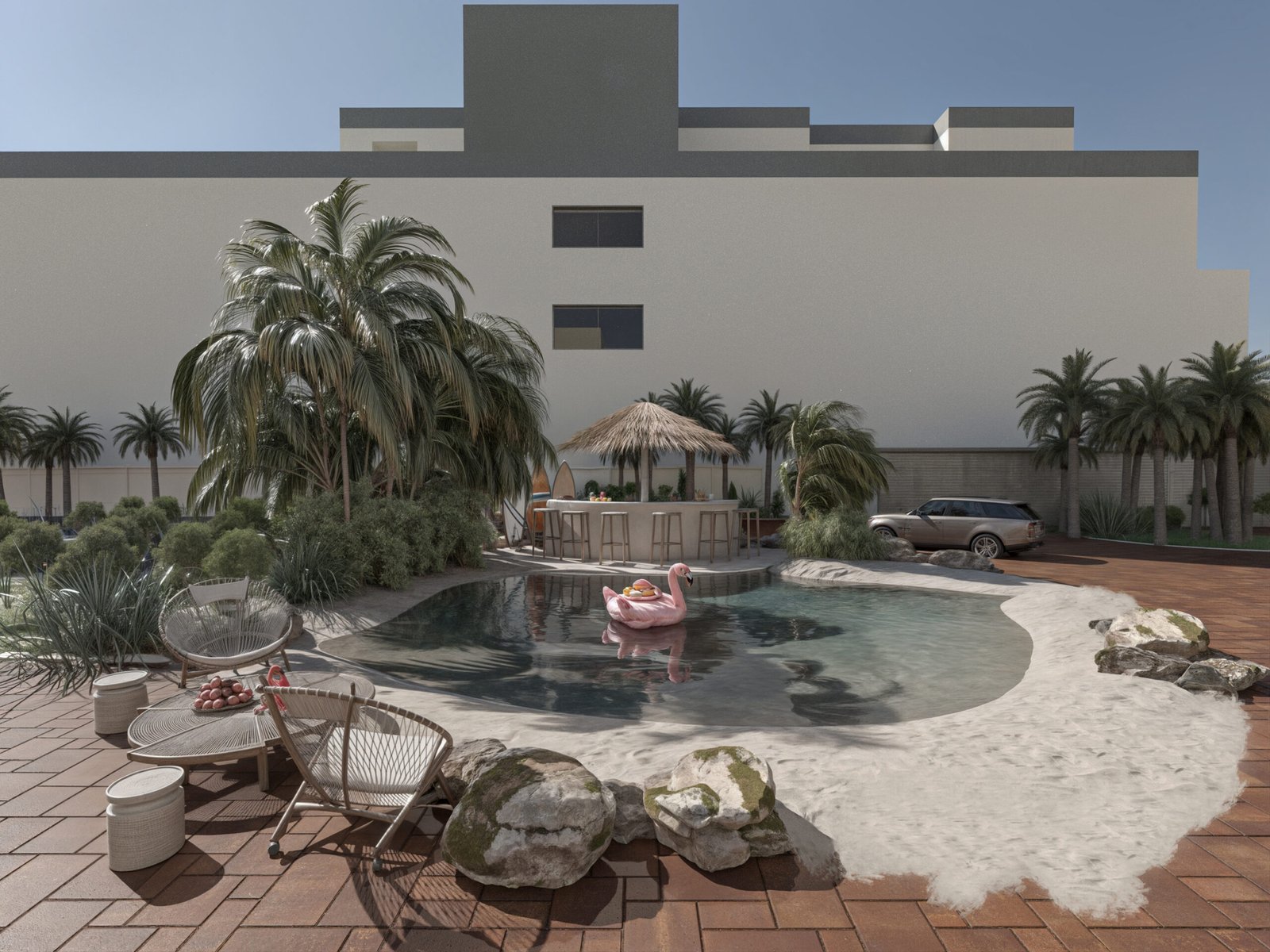 A lagoon-shaped pool surrounded by palm trees, natural rocks, and contemporary architecture creating a private beach atmosphere.