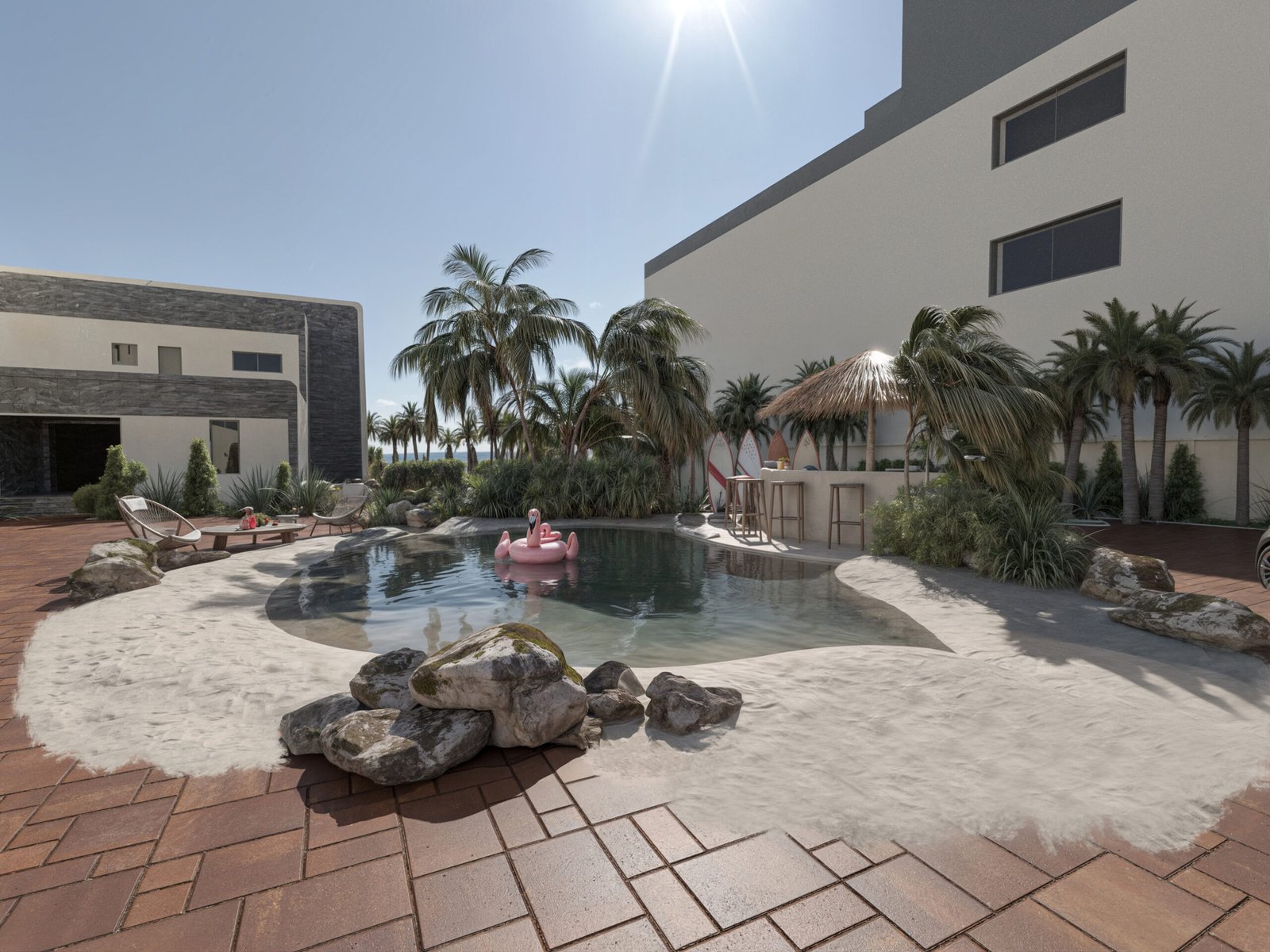A lagoon-shaped pool surrounded by palm trees, natural rocks, and contemporary architecture creating a private beach atmosphere.